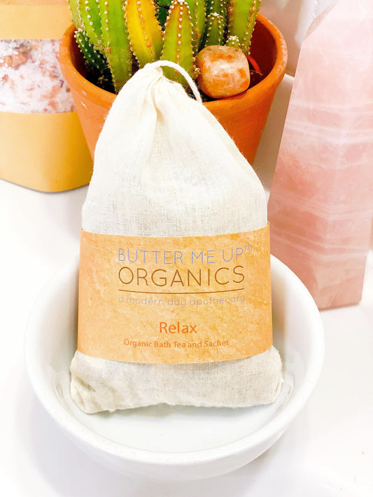 Butter Me Up Organics bath tea package with a cactus plant in the background