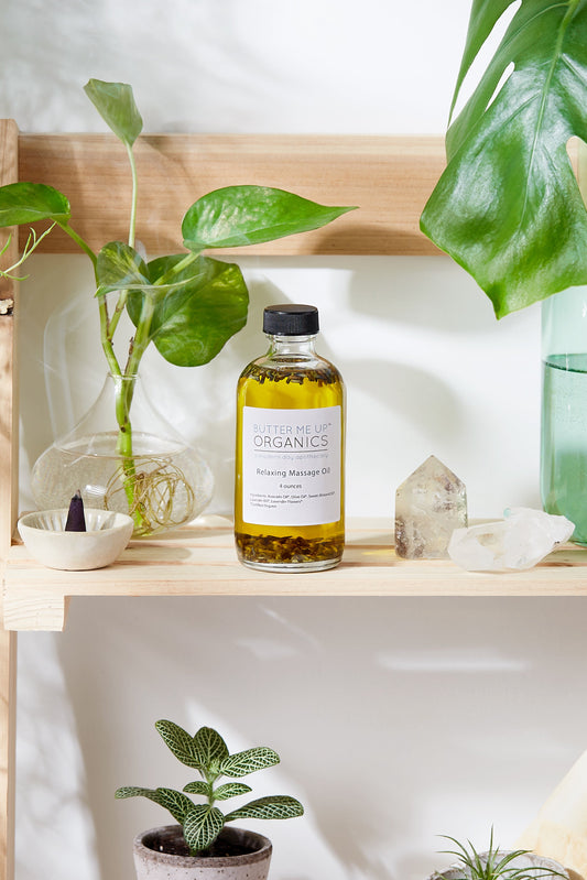 Bottle of skincare product on a shelf with plants and crystals