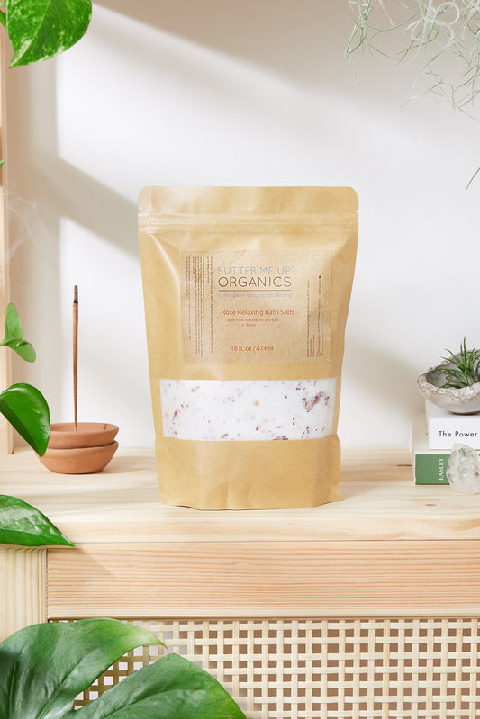 Bag of organic products on a wooden shelf with plants in the background
