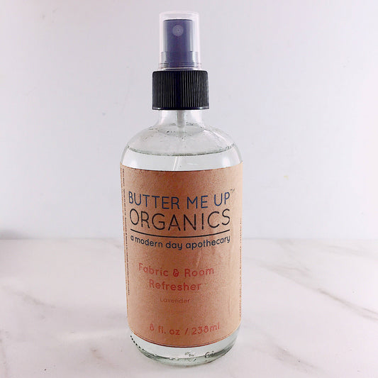 Butter Me Up Organics fabric and room refresher bottle on a white background