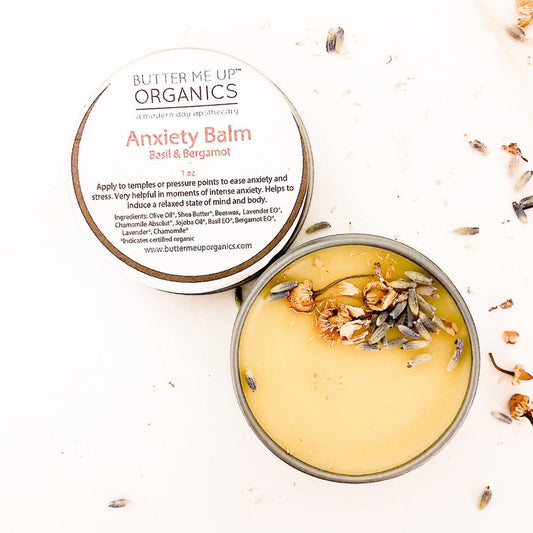 Butter Me Up Organics Anxiety Balm with lid open on a white background