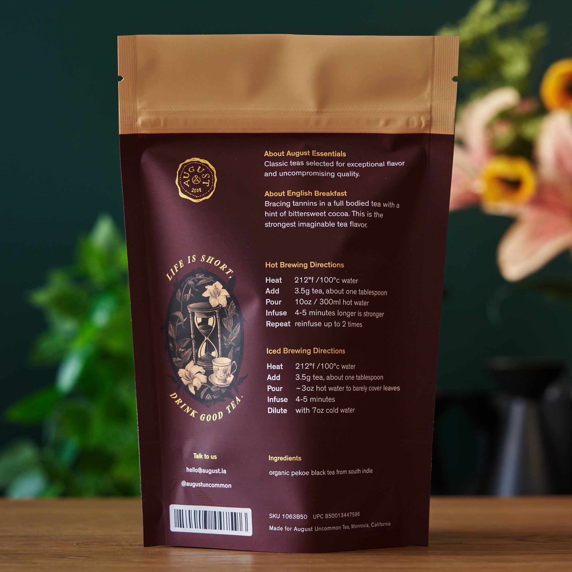 Tea package with brewing instructions and branding on a blurred natural background
