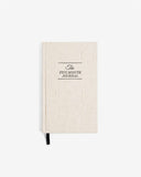 Beige journal with 'The Five Minute Journal' text on a white background