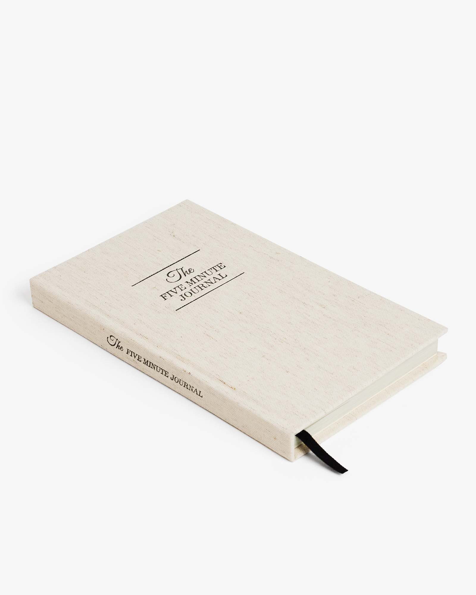 Beige journal with text on a white background