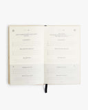 Open notebook with lined pages on a white background
