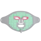 LED face mask with green light on a white background