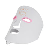 White LED face mask with pink accents and 'Happy Sol' branding on a white background