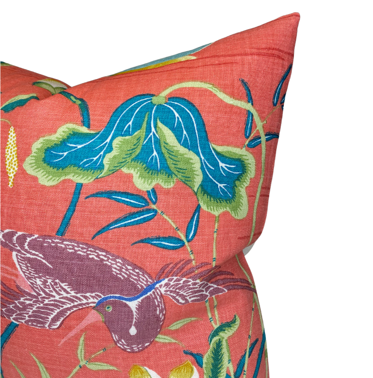 Decorative pillow with bird and leaf pattern on a red background