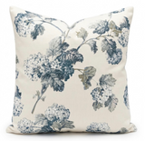 Decorative pillow with blue floral pattern on a white background