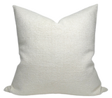 Textured white pillow on a white background