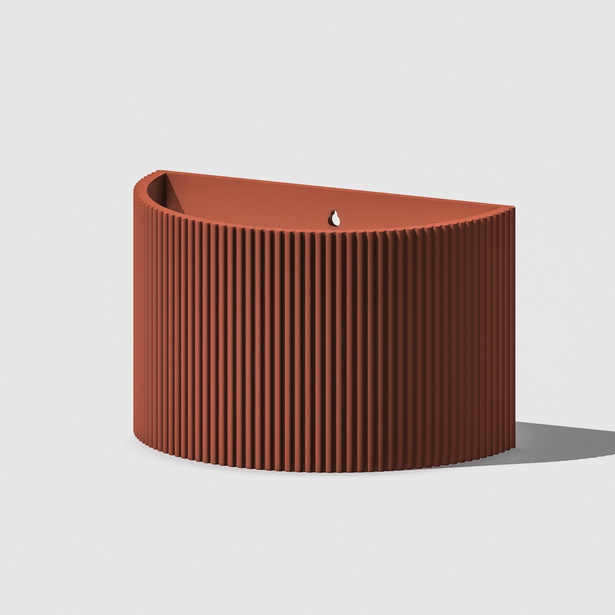Brown ribbed planter on a light gray background