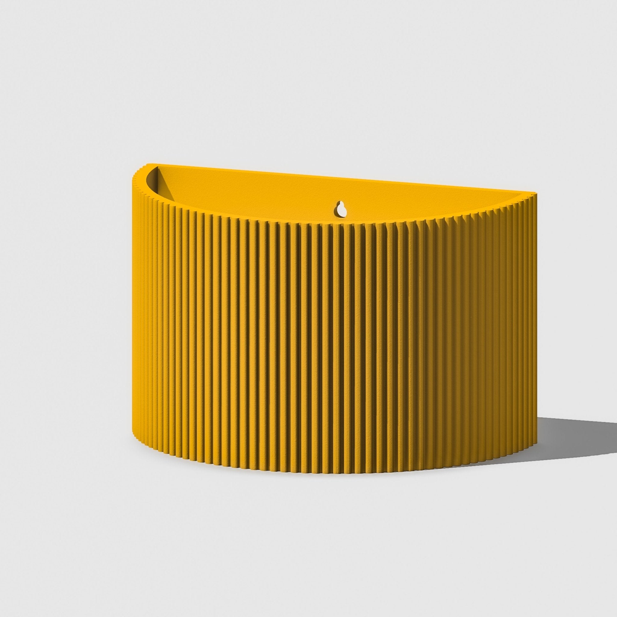 Yellow ribbed planter on a light gray background